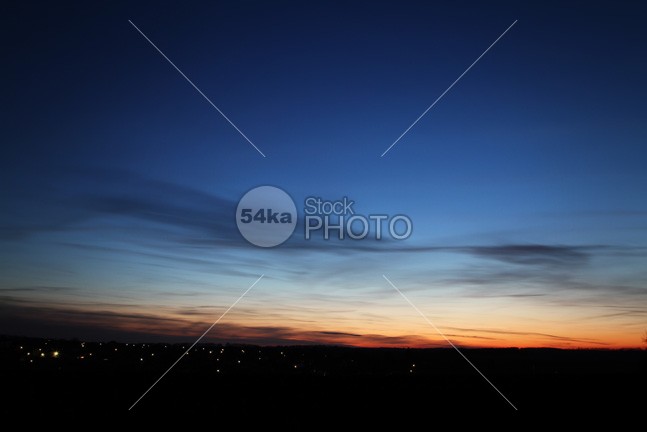 Sunset over the small city winter water village view travel town sunset sunny sundown sun street small sky romantic romance red panorama outdoor old night nature landscape houses house holiday historic evening Colors clouds cloud city building blue beautiful architecture 54ka StockPhoto
