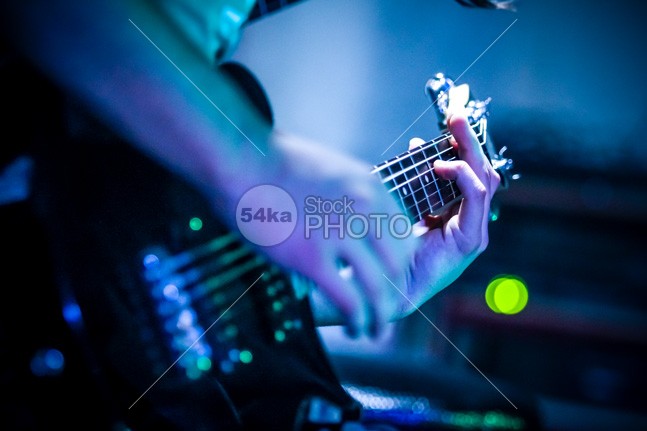 Close-up guitar – blue background young studio Standing sound solo sensual rocker rock playing player person performance musician musical music modern model Men Male light colored instrument Indoors holding high fidelity handsome guy guitarist guitar fun Fashion expression entertainment energy emotion Electric guitar Electric cool concert color chord blue 54ka StockPhoto